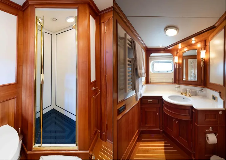 Catalina Yacht Photos Pics Luxurious wooden bathroom interior on 2001 Vitters Cruising Ketch yacht, featuring shower and vanity.