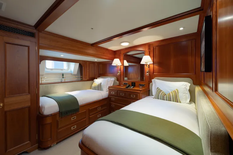 Catalina Yacht Photos Pics Luxurious cabin interior of 2001 Vitters Cruising Ketch with twin beds and elegant wood finish.