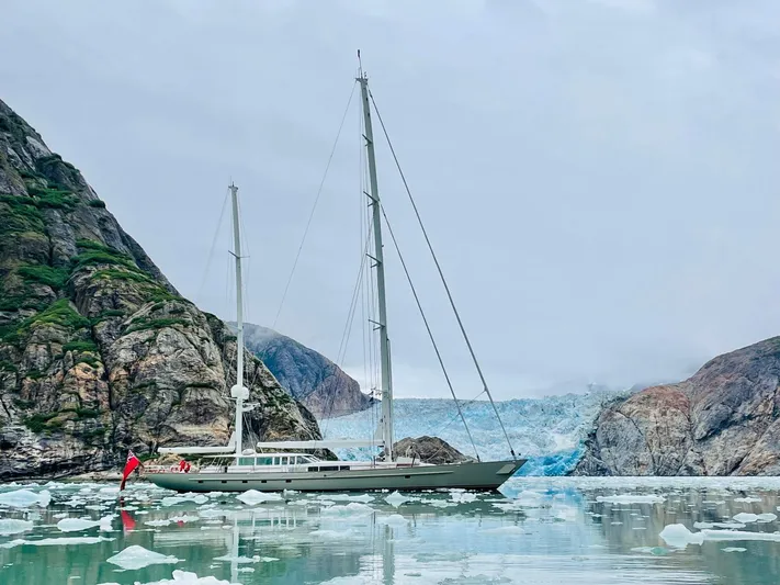 Catalina Yacht Photos Pics Vitters 2001 Cruising Ketch sailing near icy cliffs and glacier.