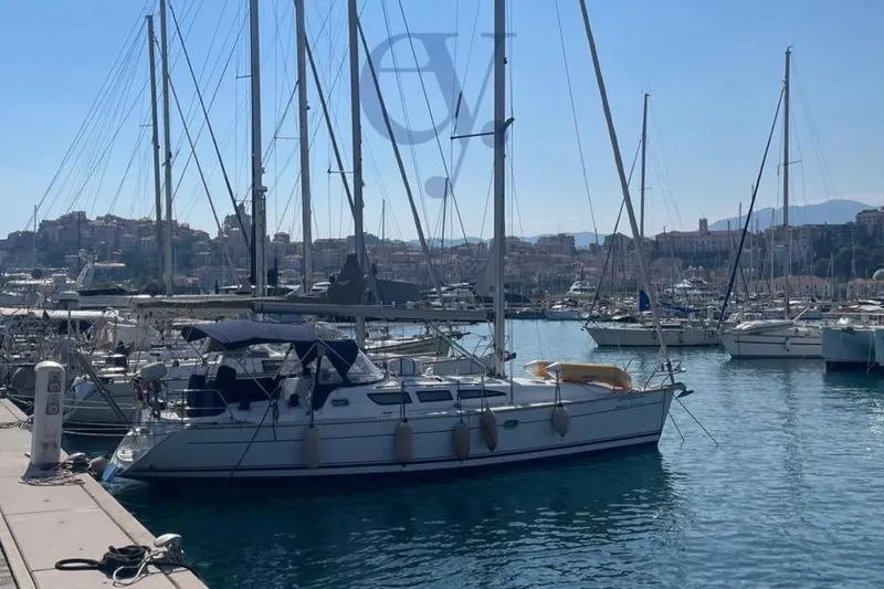  Yacht Photos Pics 2004 Jeanneau Sun Odyssey 40.3 sailboat docked in a marina with scenic background.