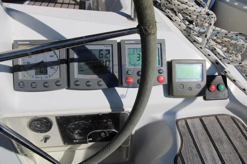  Yacht Photos Pics Control panel of a 2004 Jeanneau Sun Odyssey 40.3 sailboat with navigation instruments.