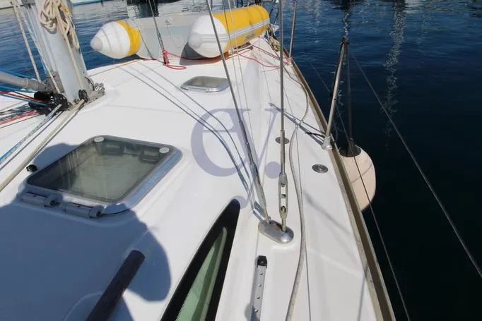  Yacht Photos Pics 2004 Jeanneau Sun Odyssey 40.3 sailboat deck with lifebuoy and rigging.