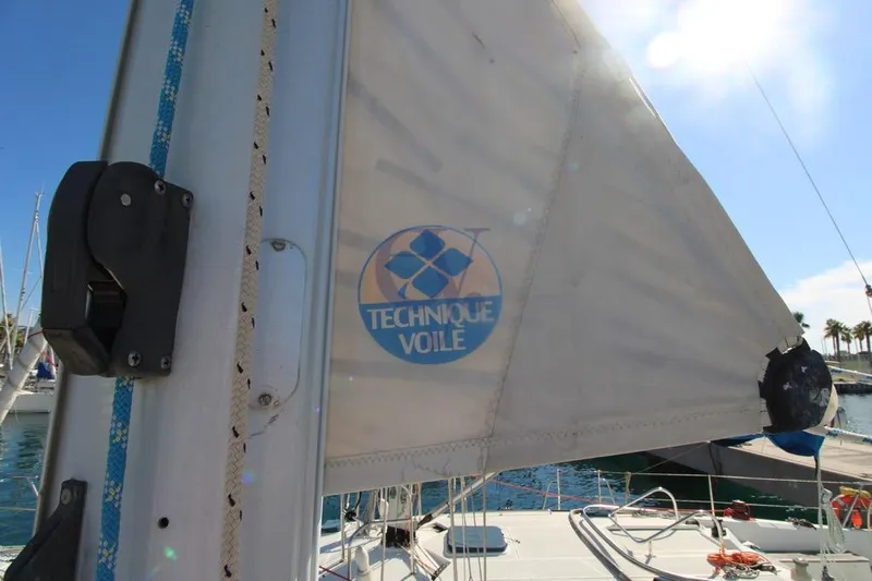  Yacht Photos Pics Sail of 2004 Jeanneau Sun Odyssey 40.3 yacht with Technique Voile logo.