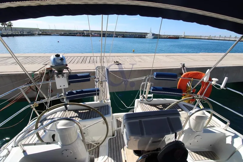  Yacht Photos Pics Cockpit view of 2004 Jeanneau Sun Odyssey 40.3 yacht docked at marina.