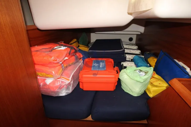  Yacht Photos Pics Storage area in a 2004 Jeanneau Sun Odyssey 40.3 yacht with safety equipment.