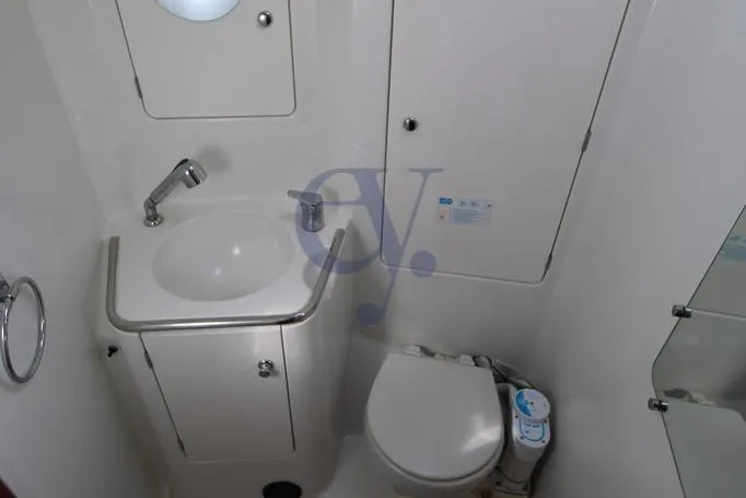  Yacht Photos Pics Bathroom interior of 2004 Jeanneau Sun Odyssey 40.3 yacht, featuring sink and toilet.
