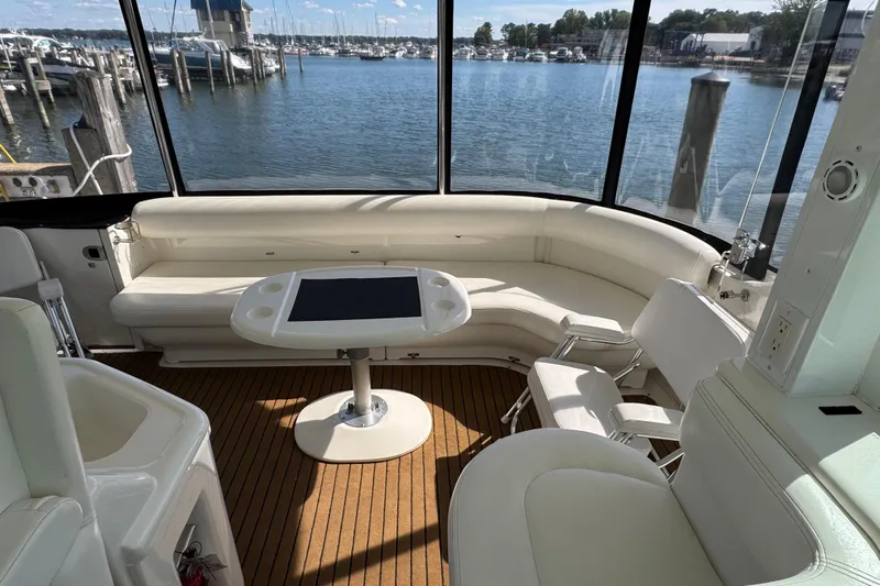  Yacht Photos Pics 2004 Sea Ray 390 Motor Yacht interior with white seating and waterfront view.