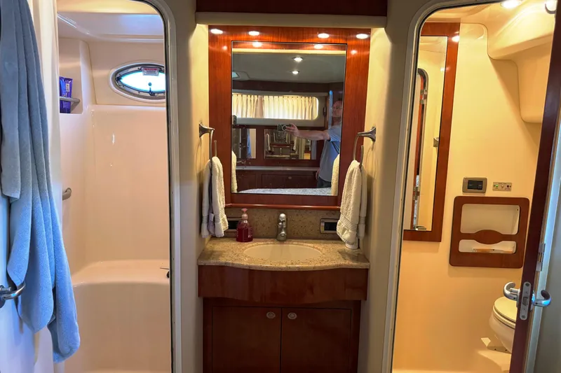  Yacht Photos Pics Luxurious bathroom interior of 2004 Sea Ray 390 Motor Yacht with shower and vanity.