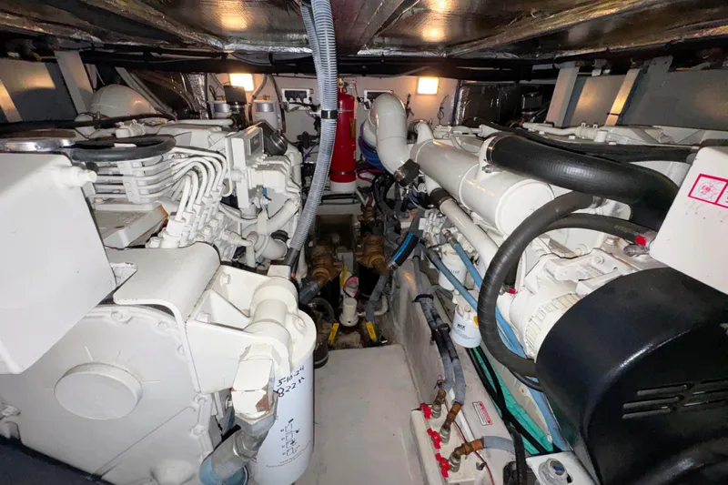  Yacht Photos Pics Engine room of a 2004 Sea Ray 390 Motor Yacht, showcasing dual engines and mechanical components.