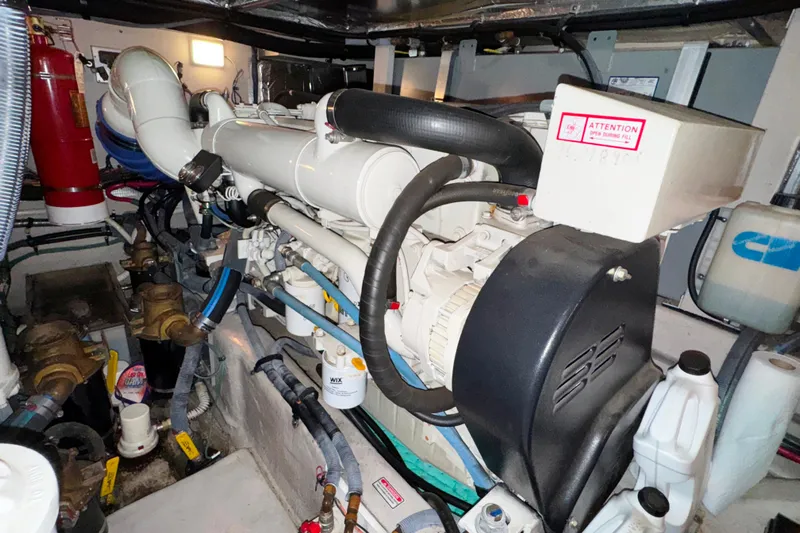  Yacht Photos Pics Engine room of a 2004 Sea Ray 390 Motor Yacht, showcasing mechanical components.