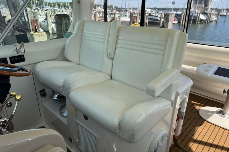  Yacht Photos Pics 2004 Sea Ray 390 Motor Yacht interior with white leather seating and marina view.