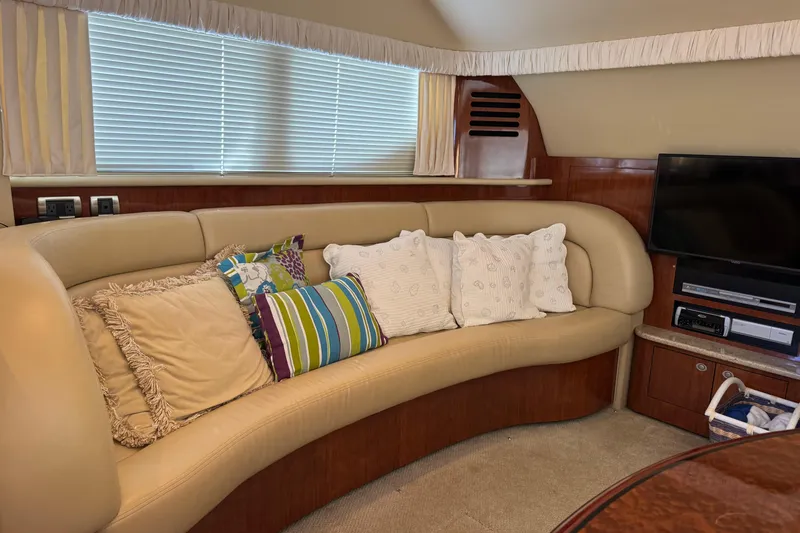  Yacht Photos Pics Luxurious interior of 2004 Sea Ray 390 Motor Yacht with plush seating and entertainment system.