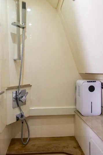  Yacht Photos Pics Shower area in a 2017 Scout 420 LXF boat, featuring modern fixtures.