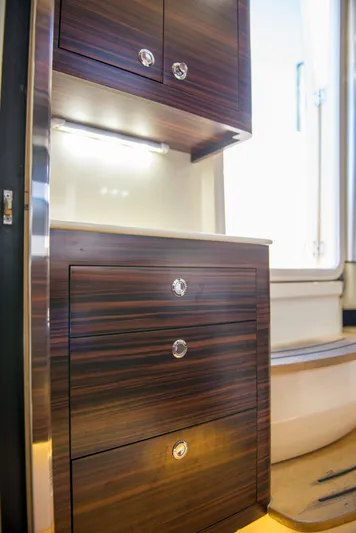  Yacht Photos Pics 2017 Scout 420 LXF interior with sleek wooden cabinetry and modern design.