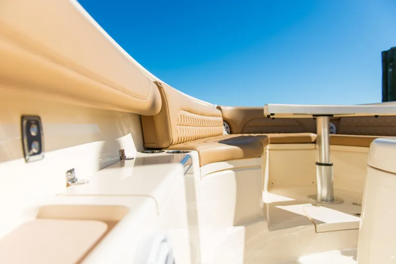  Yacht Photos Pics Luxurious seating area on a 2017 Scout 420 LXF boat under clear blue skies.