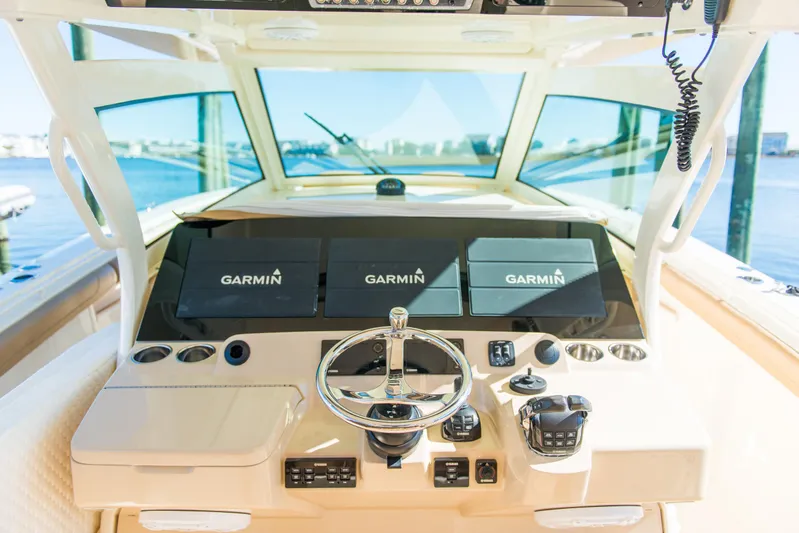  Yacht Photos Pics 2017 Scout 420 LXF boat dashboard with Garmin navigation displays.