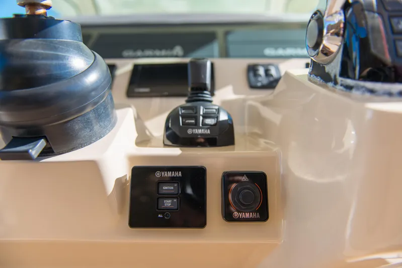  Yacht Photos Pics Control panel of 2017 Scout 420 LXF boat featuring Yamaha controls and displays.