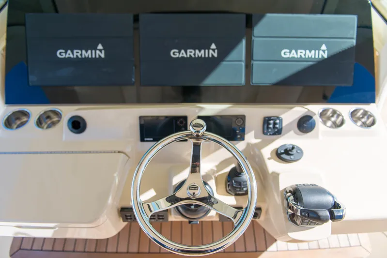  Yacht Photos Pics Control panel of 2017 Scout 420 LXF with Garmin navigation displays.