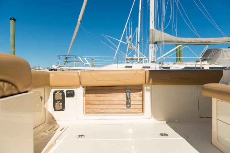  Yacht Photos Pics 2017 Scout 420 LXF boat interior with tan seating and wooden accents.
