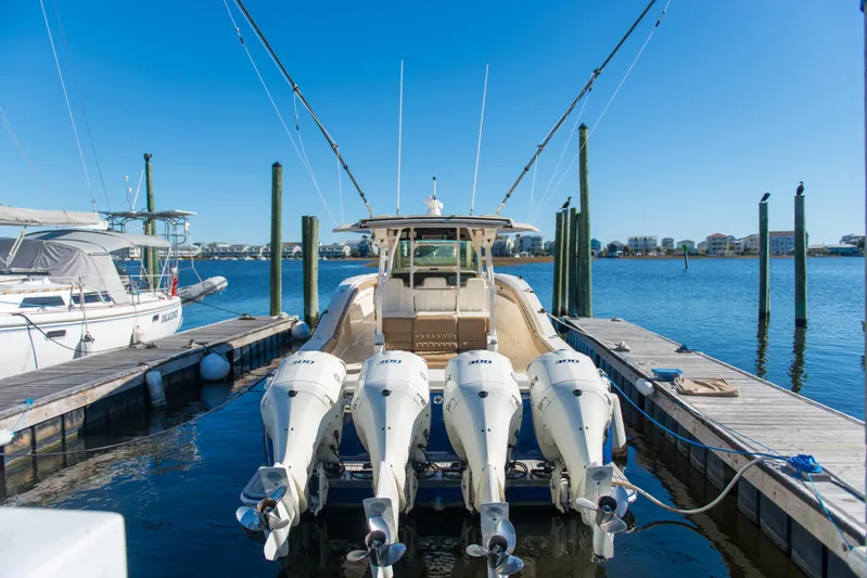  Yacht Photos Pics 2017 Scout 420 LXF boat docked with four powerful outboard engines.