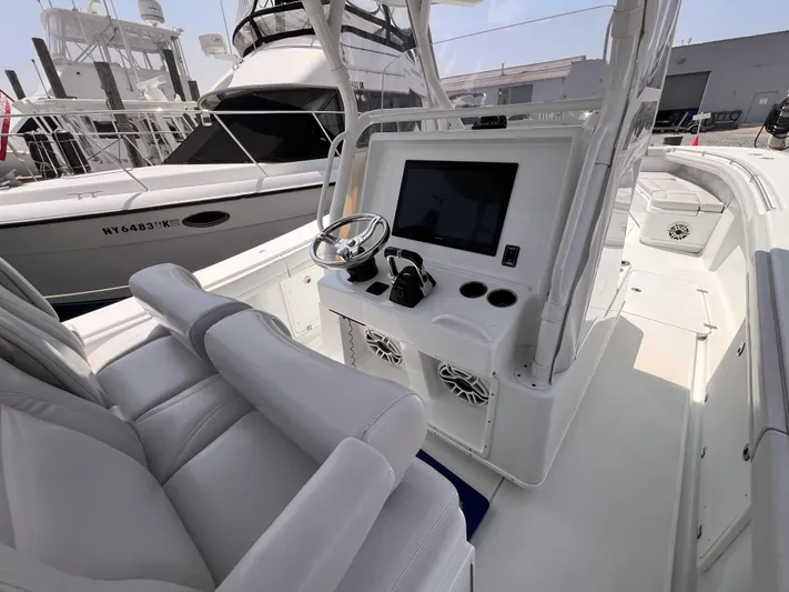  Yacht Photos Pics 2020 Yellowfin 36 boat interior with modern helm and seating.