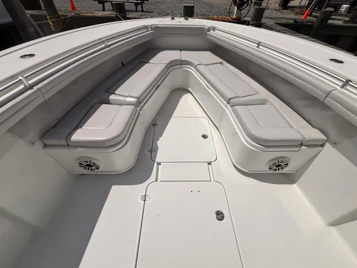  Yacht Photos Pics 2020 Yellowfin 36 boat interior with cushioned seating and speakers.