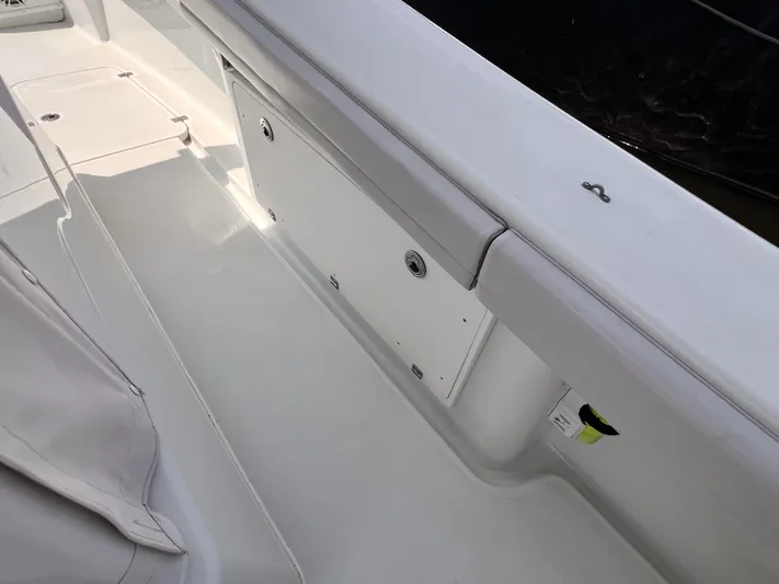  Yacht Photos Pics 2020 Yellowfin 36 boat interior with storage compartment and seating area.