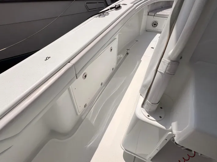  Yacht Photos Pics 2020 Yellowfin 36 boat interior, featuring sleek white deck and storage compartments.