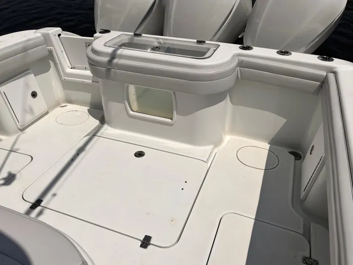  Yacht Photos Pics 2020 Yellowfin 36 boat deck with storage compartments and clean white finish.