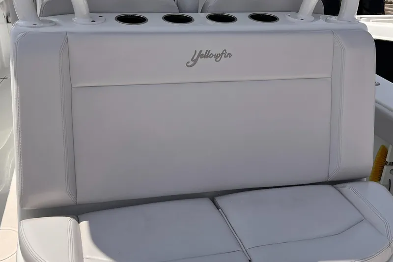  Yacht Photos Pics 2020 Yellowfin 36 boat seat with cup holders and logo detail.