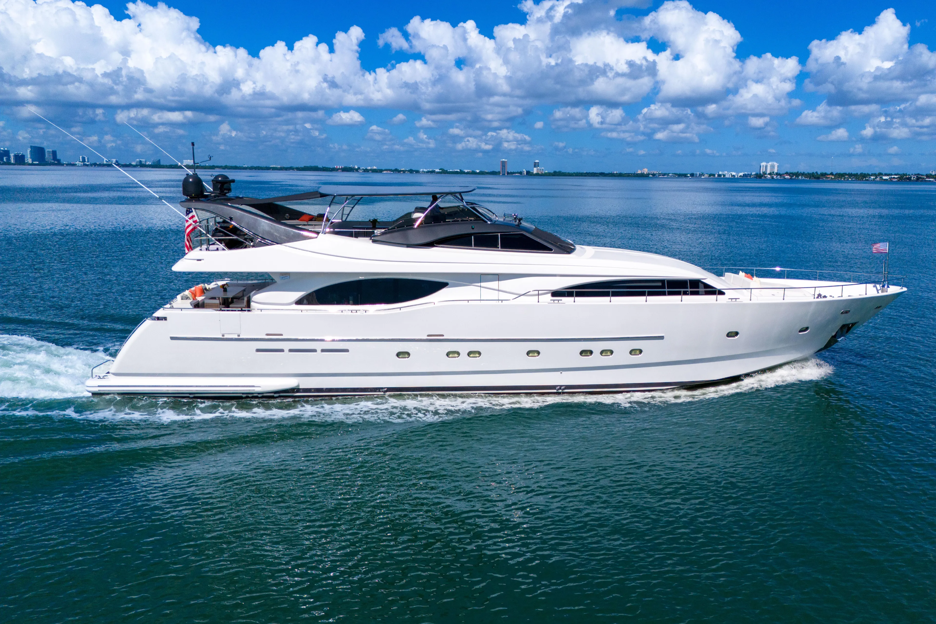 Sinpatico Yacht Photos Pics Luxurious 2002 Ferretti Yachts Custom Line 94 cruising on serene blue waters.