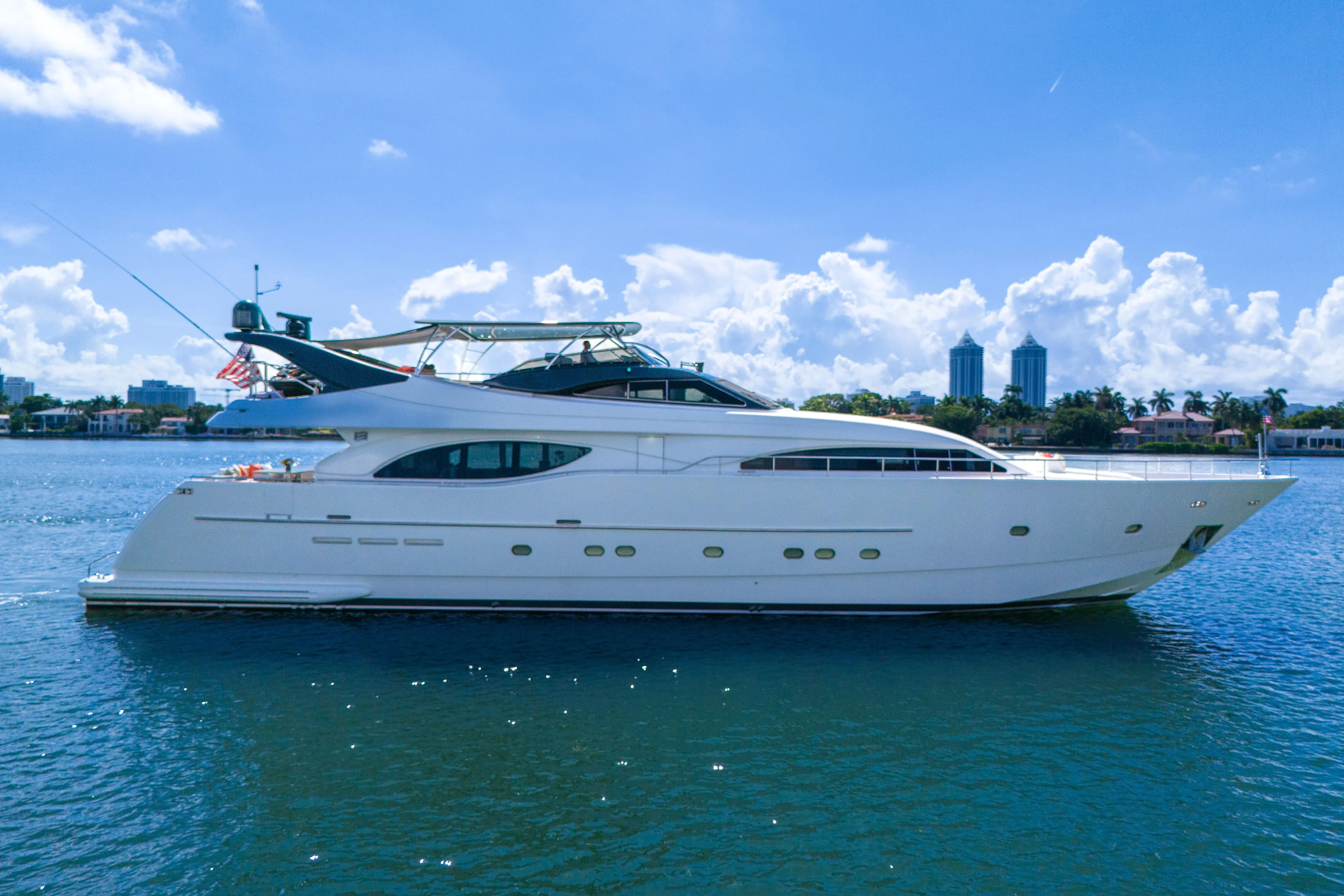 Sinpatico Yacht Photos Pics Luxury 2002 Ferretti Yachts Custom Line 94 on serene water, clear sky background.