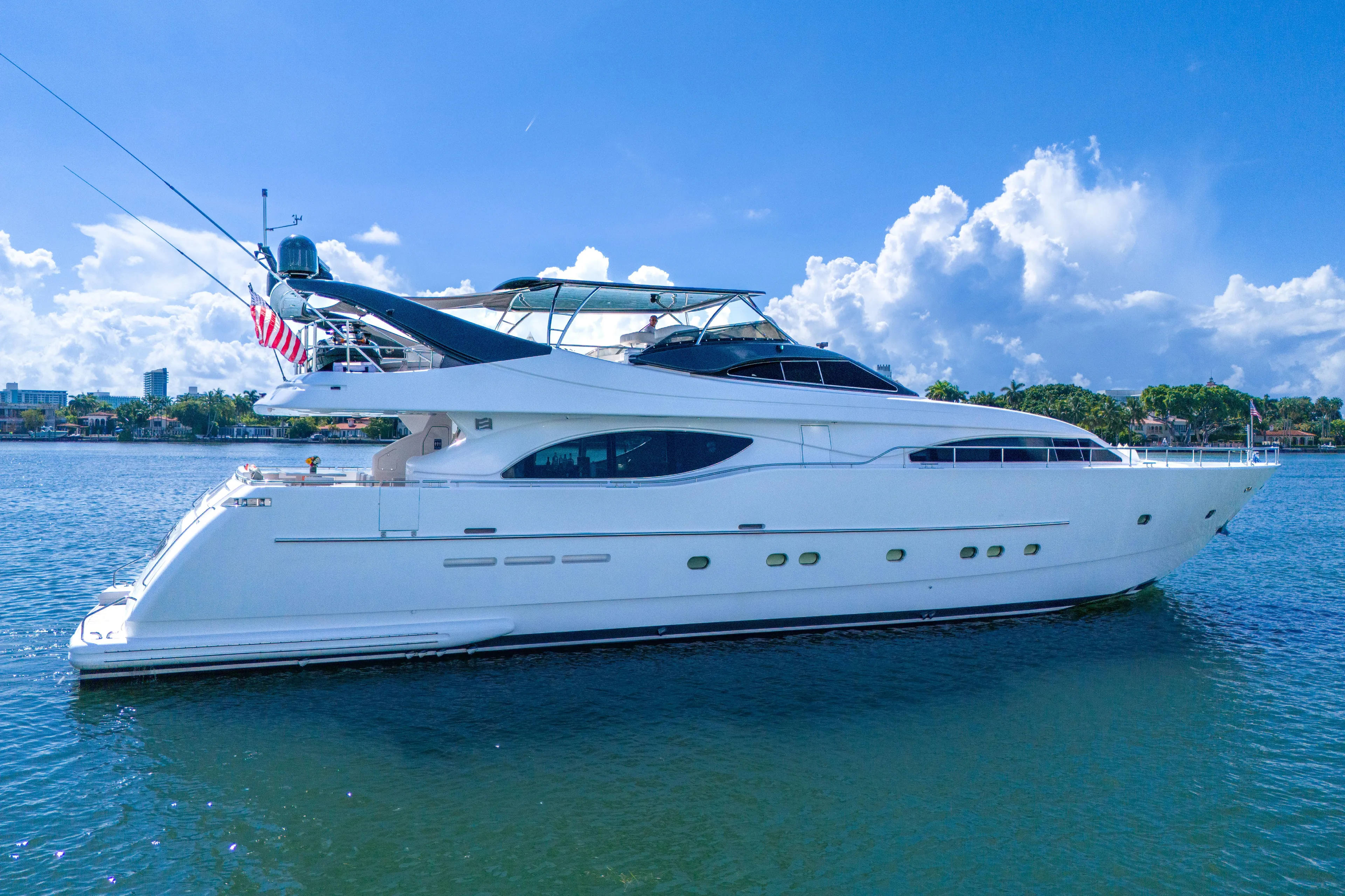Sinpatico Yacht Photos Pics Luxury 2002 Ferretti Yachts Custom Line 94 on serene water under blue sky.