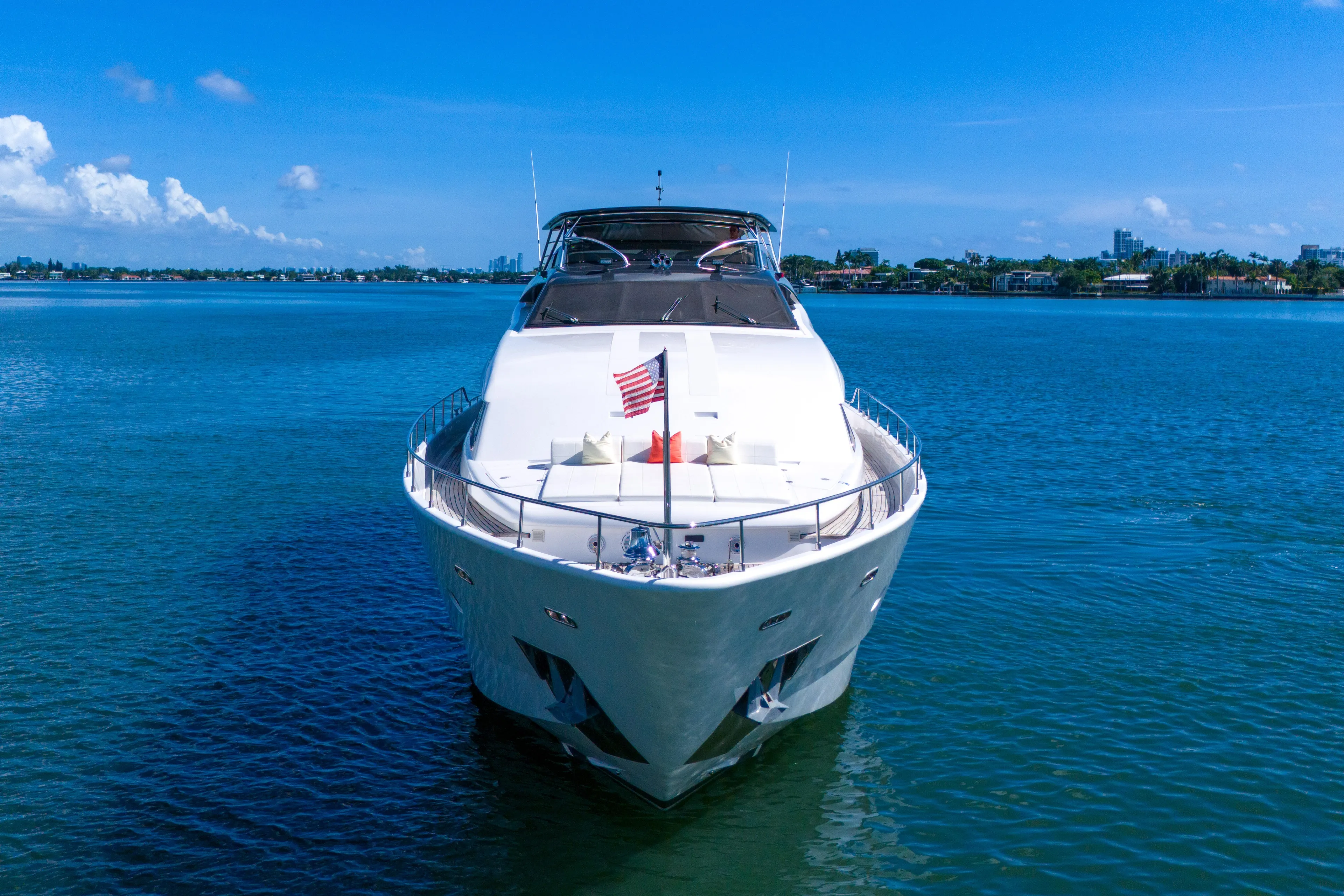 Sinpatico Yacht Photos Pics Ferretti Yachts Custom Line 94, 2002 model, cruising on a clear blue sea.