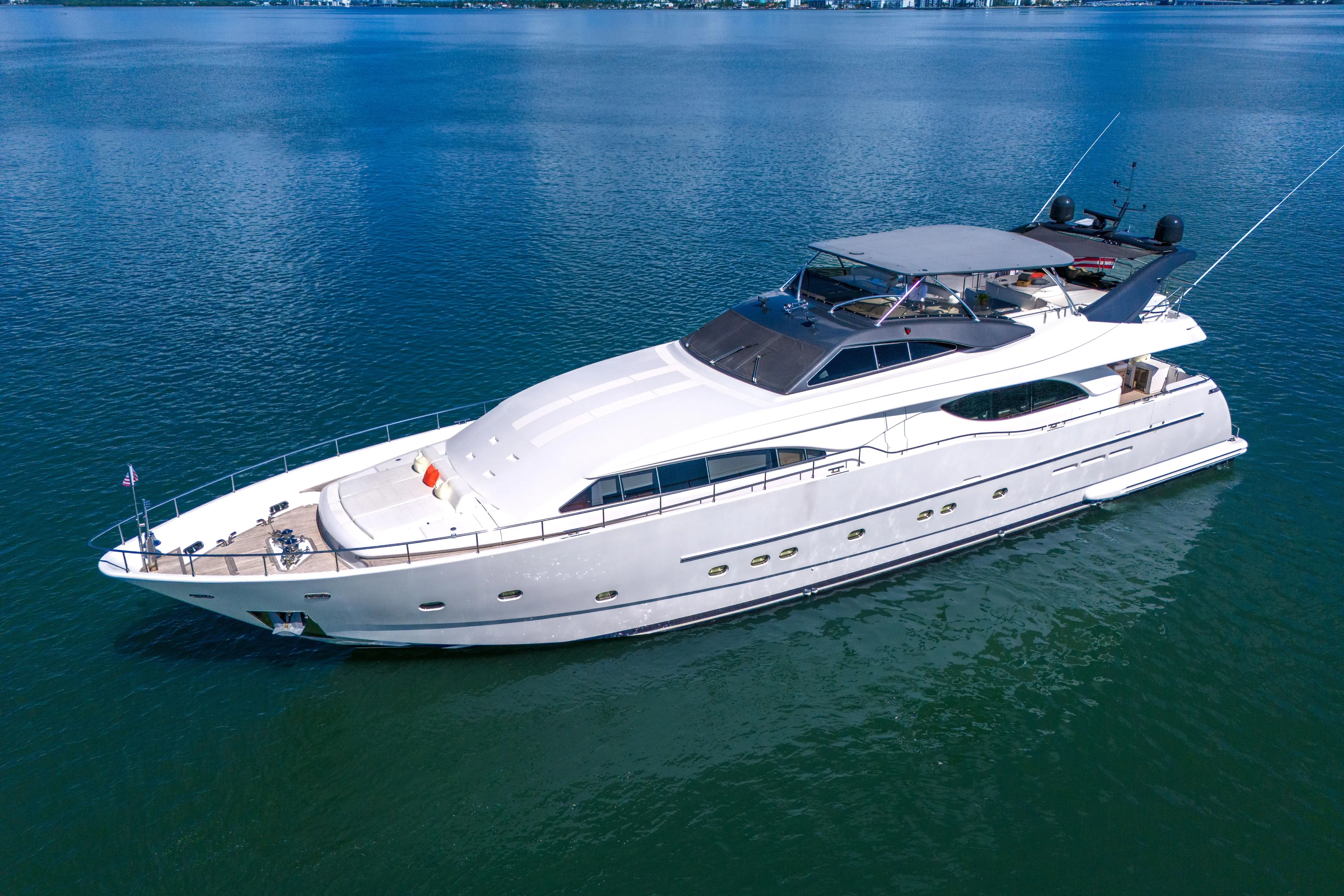 Sinpatico Yacht Photos Pics Luxurious 2002 Ferretti Yachts Custom Line 94 cruising on serene blue waters.