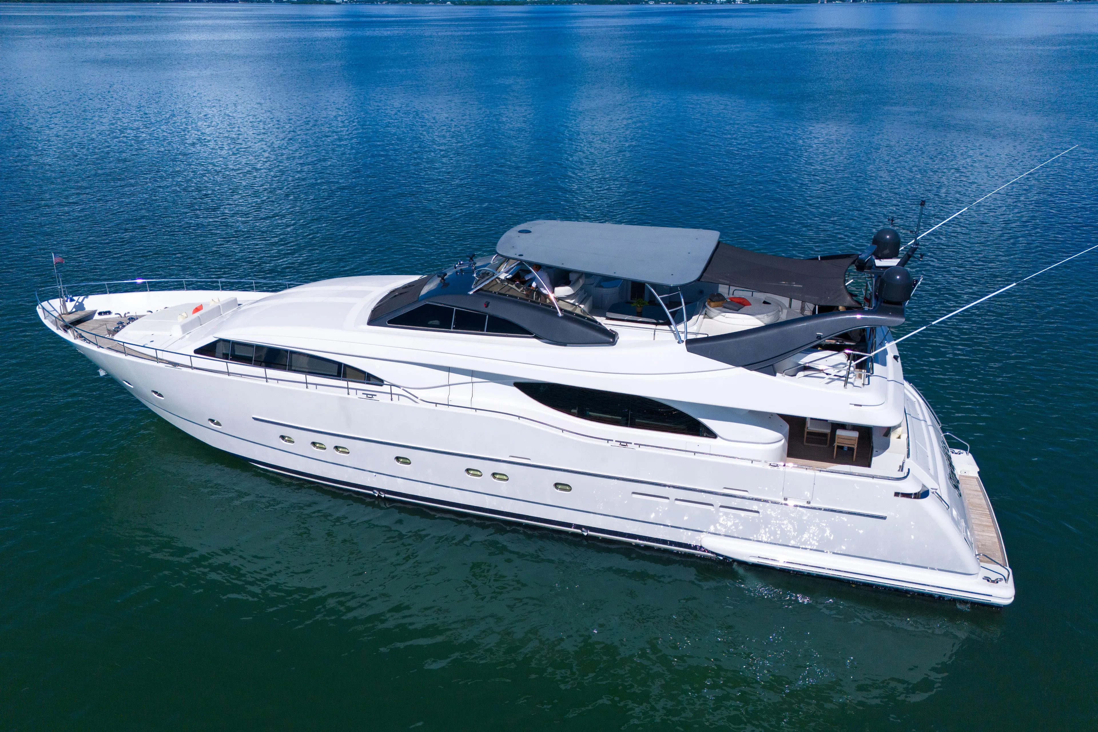 Sinpatico Yacht Photos Pics Luxurious 2002 Ferretti Yachts Custom Line 94 cruising on serene waters.