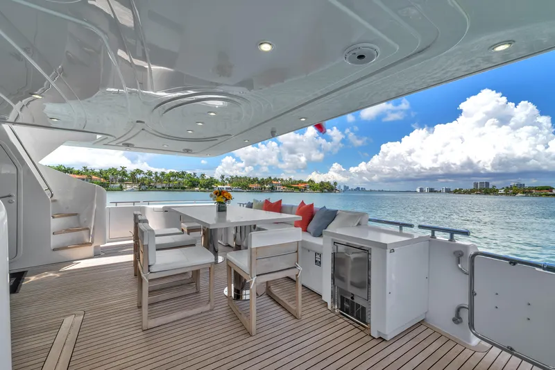 Sinpatico Yacht Photos Pics Luxurious 2002 Ferretti Yachts Custom Line 94 deck with elegant seating and scenic ocean view.