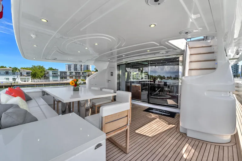 Sinpatico Yacht Photos Pics Luxurious 2002 Ferretti Yachts Custom Line 94 deck with elegant seating and dining area.