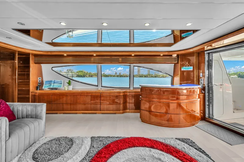 Sinpatico Yacht Photos Pics Luxurious interior of 2002 Ferretti Yachts Custom Line 94 with elegant wood finishes and waterfront view.