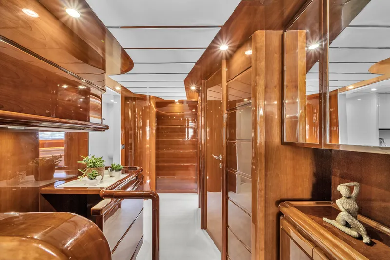 Sinpatico Yacht Photos Pics Luxurious wooden interior of 2002 Ferretti Yachts Custom Line 94, featuring elegant decor.