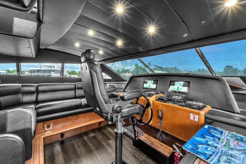 Sinpatico Yacht Photos Pics Luxurious helm of 2002 Ferretti Yachts Custom Line 94 with leather seating and advanced controls.