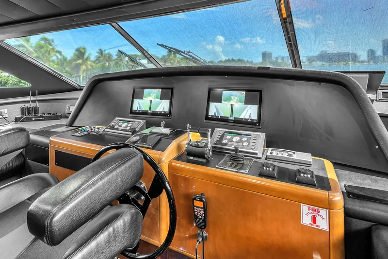 Sinpatico Yacht Photos Pics Helm of 2002 Ferretti Yachts Custom Line 94 with modern navigation equipment and controls.