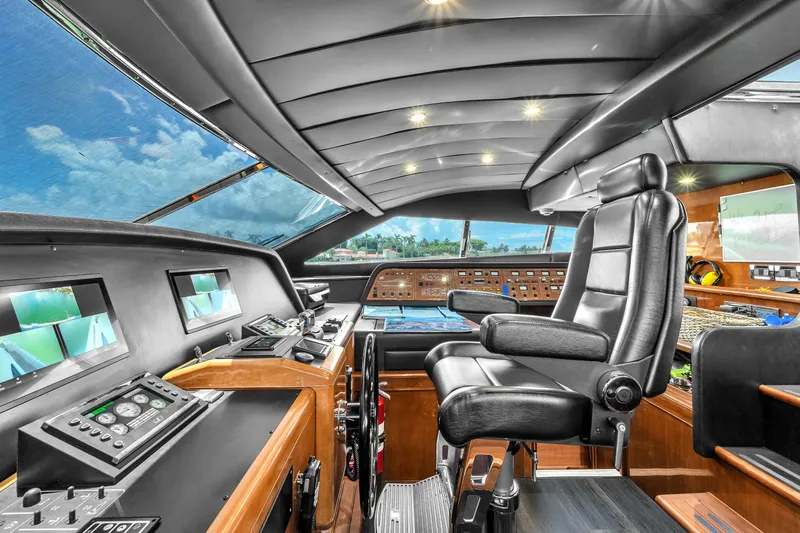 Sinpatico Yacht Photos Pics Luxurious helm of 2002 Ferretti Yachts Custom Line 94, featuring advanced navigation controls.