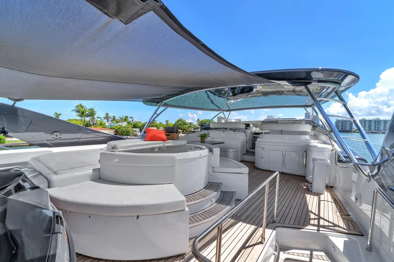 Sinpatico Yacht Photos Pics Luxurious 2002 Ferretti Yachts Custom Line 94 deck with seating, canopy, and ocean view.