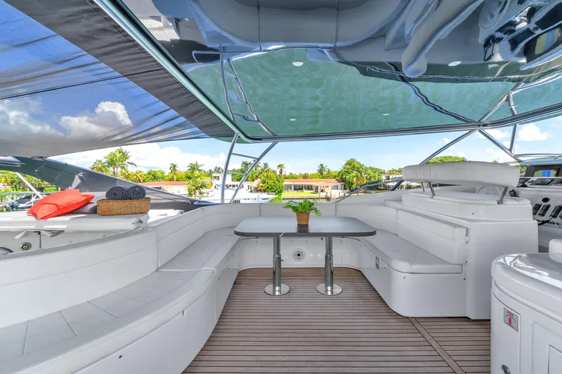 Sinpatico Yacht Photos Pics Luxurious 2002 Ferretti Yachts Custom Line 94 deck with seating, table, and canopy.