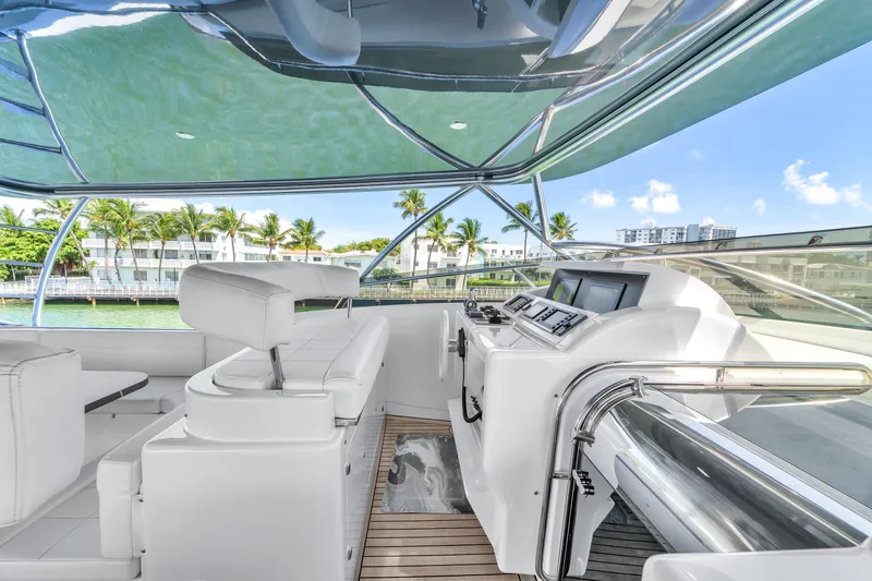 Sinpatico Yacht Photos Pics Luxurious 2002 Ferretti Yachts Custom Line 94 helm with modern controls and panoramic views.