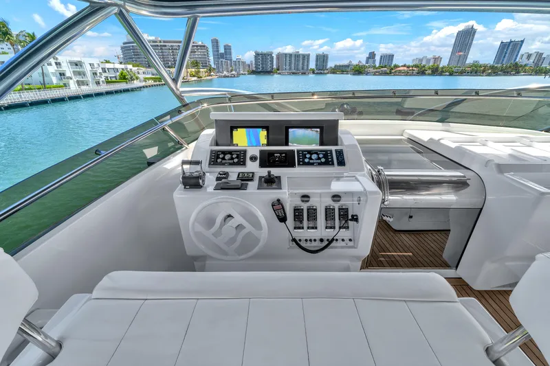 Sinpatico Yacht Photos Pics Helm of 2002 Ferretti Yachts Custom Line 94 with city skyline view.