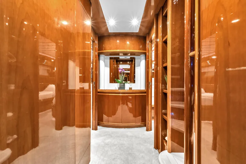 Sinpatico Yacht Photos Pics Luxurious interior of 2002 Ferretti Yachts Custom Line 94 with polished wood finishes.