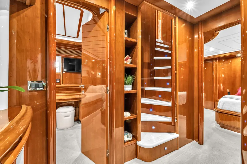 Sinpatico Yacht Photos Pics Luxurious interior of 2002 Ferretti Yachts Custom Line 94 with elegant wood finishes.