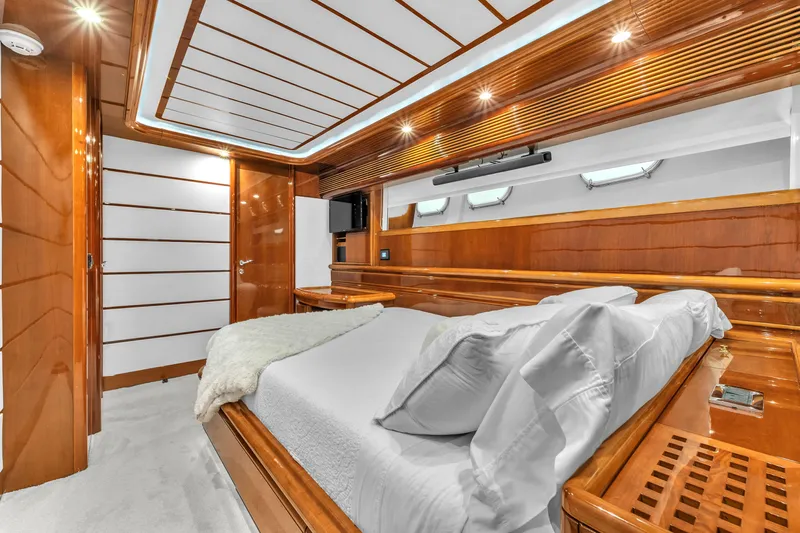 Sinpatico Yacht Photos Pics Luxurious cabin interior of 2002 Ferretti Yachts Custom Line 94, featuring elegant wood finishes.